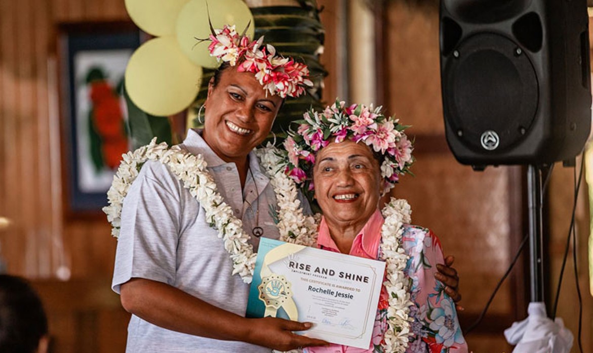 two ladies holding certificate